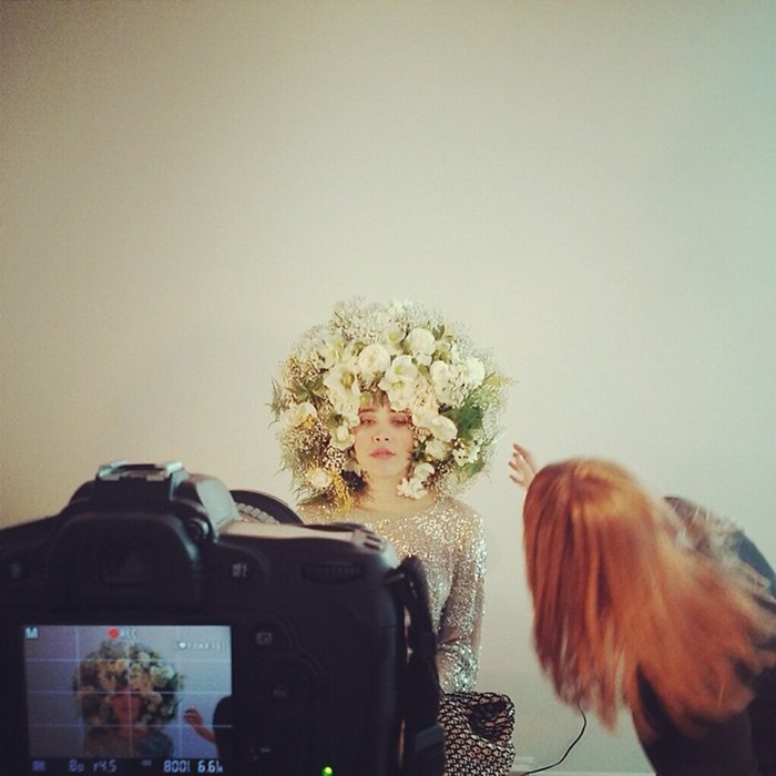 Behind the scenes as Amanda Dumouchelle photographs a model wearing a Flower Fro by Susan McLeary
