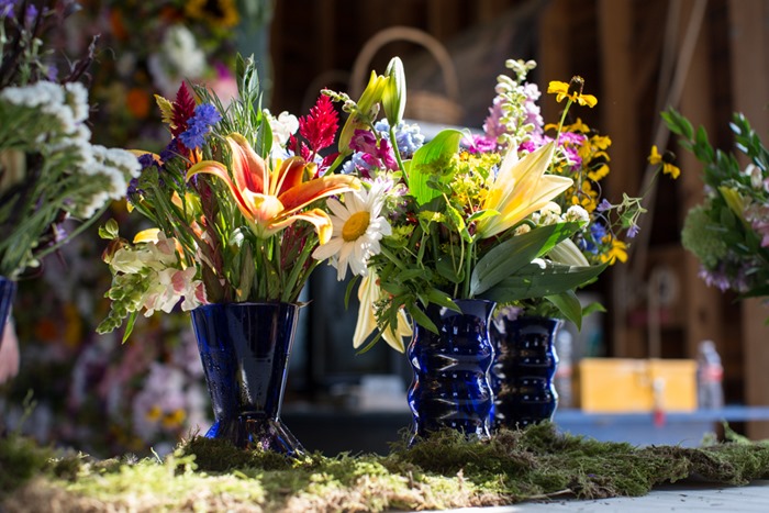 Centerpieces with local flowers and American-made vases